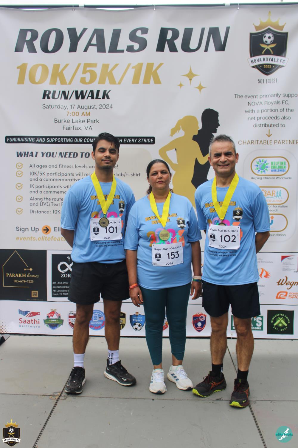 Three Royals Run finishers wearing their medals