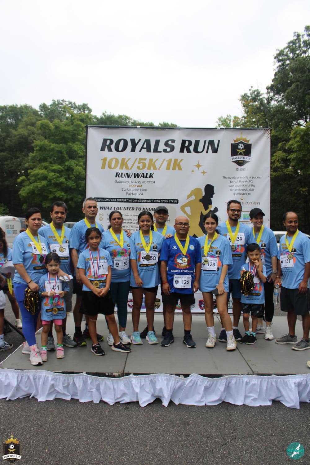 Families and runners posing with Royals Run medals