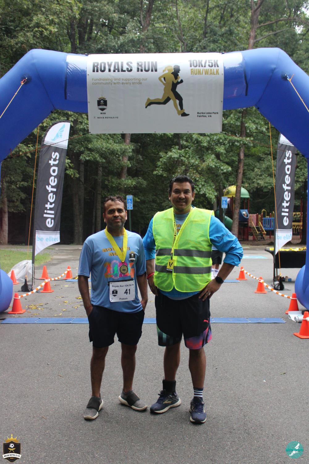 Royals Run participant and volunteer near the finish area