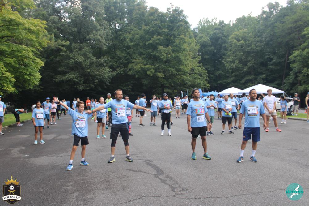 Royals Run community warming up together before the race